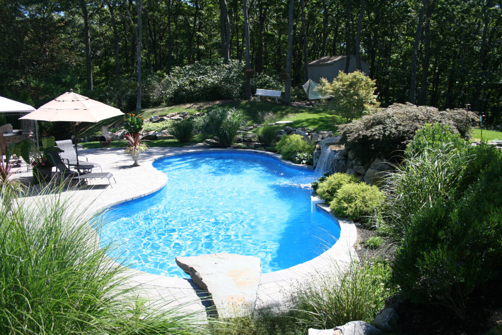 sloped yard with inground pool